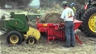 The St George Company  Round Bale Unwinder rebaling hay with a John Deere 336 baler [upl. by Loraine]