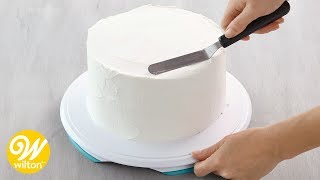 How to Crumb Coat and Ice a Cake Using a Spatula  Wilton [upl. by Alicirp]