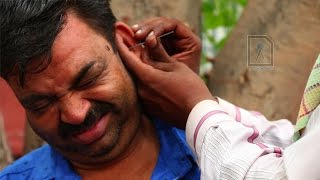 Ear Waxing  Traditional ear cleaner in India [upl. by Derman]