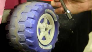 How to remove powerwheels toy ride on wheel [upl. by Enifesoj236]